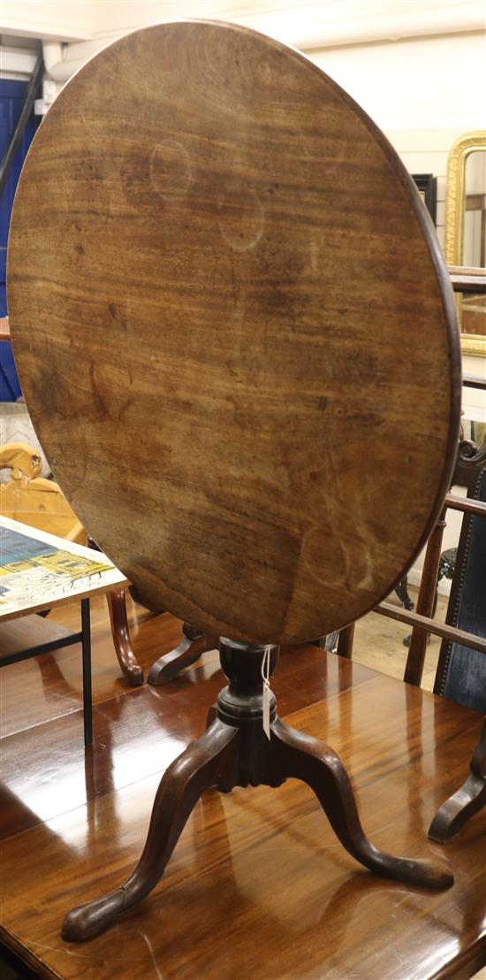 A George III mahogany circular tilt top tea table W.77cm